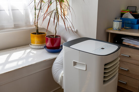 Side view of a portable air conditioning unit.