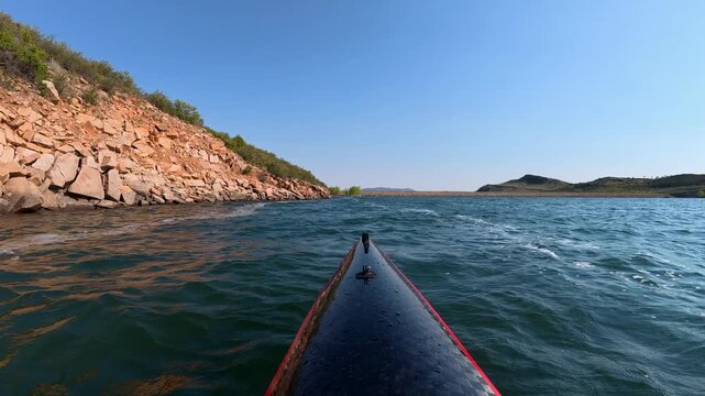 Immersive POV from a kayak - paddling on windy Horsetooth Reservoir in Fort Collins, Colorado, summer morning scenery 