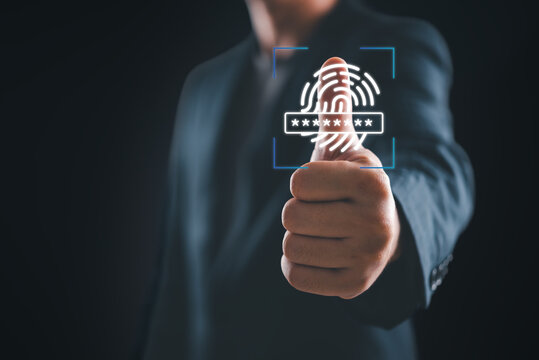 Information security technology concept with business person approving biometric verification. Virtual fingerprint scanner hologram representing safe internet access and private data encryption.