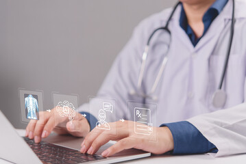 Fototapeta premium Healthcare professional using a computer with an advanced AI medical diagnostic flowchart hologram, representing modern digital medicine, telemedicine, and automated patient care tech.
