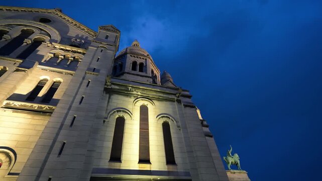 Iconic Sacr&Egrave;-C&uacute;ur Basilica at night exterior Paris skyline