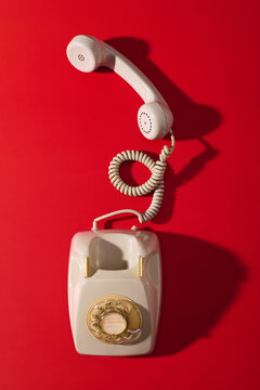Close up of a vintage rotary telephone on a table