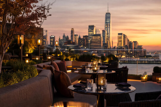 Soft Daylight Rooftop Lounge Sunset With Gold Reflections And Greenery