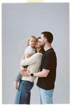 Family enjoys a moment together in a studio setting