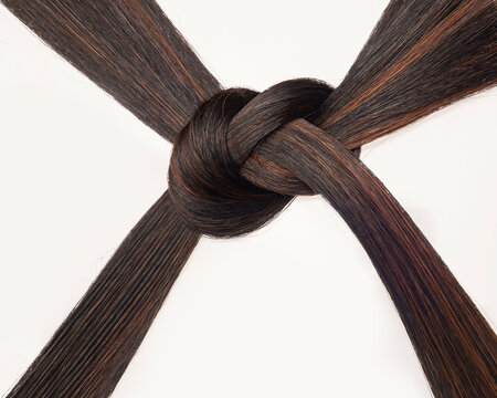 Two locks of hair knotted together