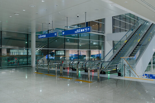 July 5, 2026, Incheon, South Korea - Interior view of Incheon International Airport Terminal 2 with escalators and directional signs.