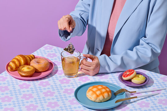 Someone preparing tea, accompanied by a delightful selection