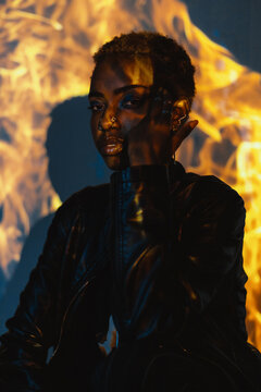 Woman Posing in a Colourful Lighting Setup Indoors