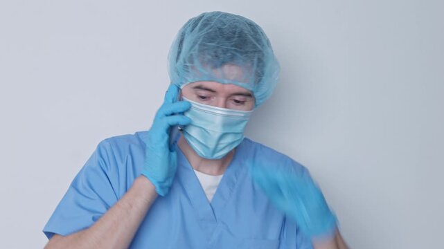 Stressed surgeon receiving bad news on phone call
