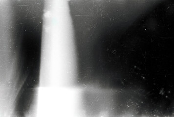 Obraz premium Dusty scratched and scanned old film texture, light leaks overlay effect. Retro analog cinematic flare. 