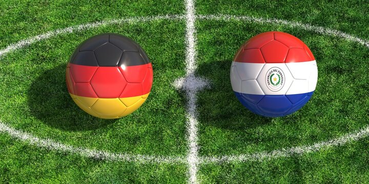 Germany versus Paraguay soccer balls on green field grass center circle kickoff