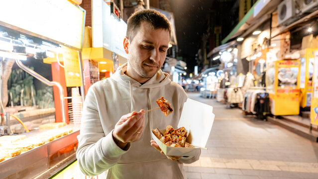 Trying stinky tofu at Shilin Night Market in Taipei