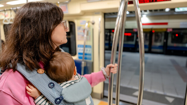 Mother and child inside a Taipei Metro train