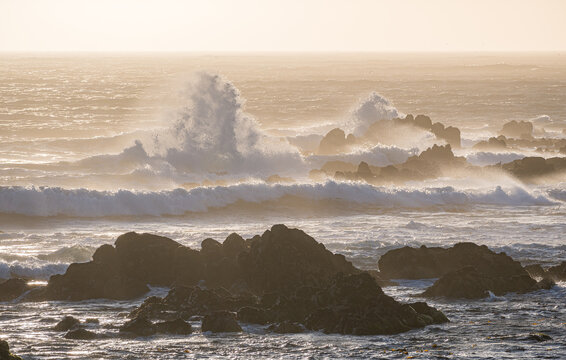 Ocean waves crashing on rocky shore at Vila do Conde