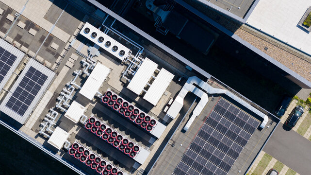 Aerial view of the Interconnect Services BV roof featuring industrial HVAC cooling units, ventilation systems, and solar panel arrays in 's-Hertogenbosch, Noord-Brabant, Netherlands.