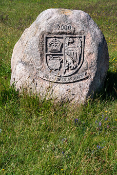 Carved memorial stone with coat of arms on Langene&szlig; island