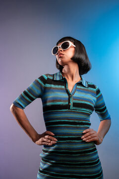 Stylish portrait of young Latin woman in retro sunglasses