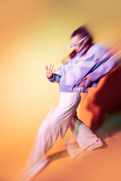 Young woman dancer in trippy lens effect and neon light