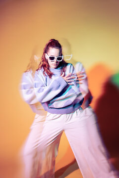 Young woman dancer with trippy lens and neon lighting