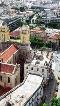 Close exterior view of Tunis Cathedral highlighting stone architecture and city landmark.