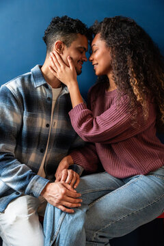Affectionate latin couple sharing an intimate moment indoors