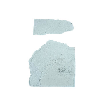 Two light blue torn paper scraps with rough edges