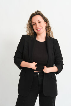 Smiling woman in black blazer showing congenital hand