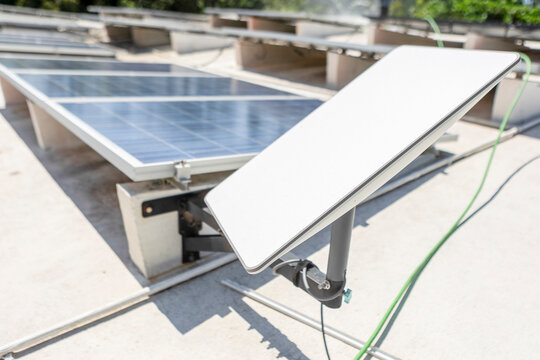 Solar panels and satellite dish for eco-friendly setup