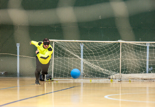 Goalball player in action demonstrating skill