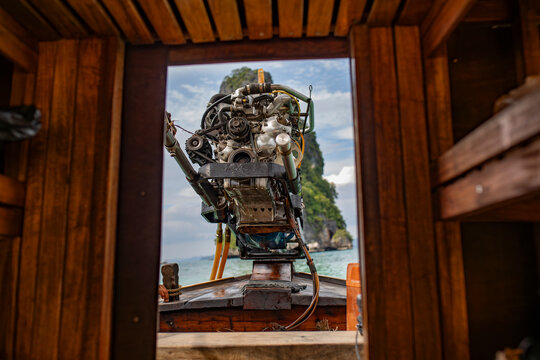 Longtail boat engine framing tropical seascape at Koh Tao