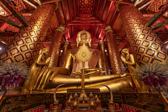 Golden Buddha statue inside ornate Thai temple, Koh Tao