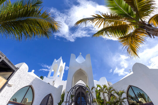 Low-angle view of white arches and towers in Mazatlan