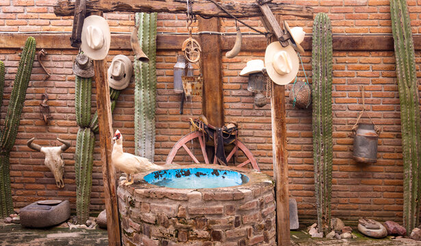 Wide-angle rustic stone well in La Noria, Mexico