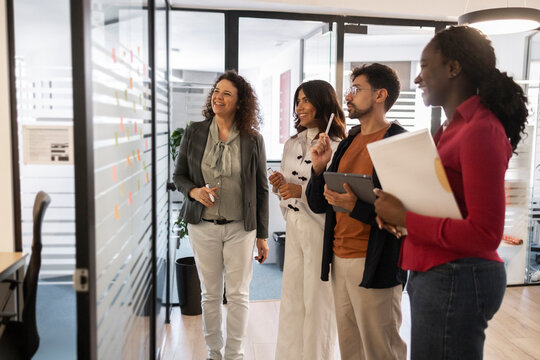 Diverse team brainstorming ideas in a modern coworking office