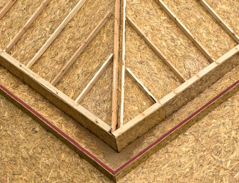 Wooden roof truss framing with OSB sheathing detail