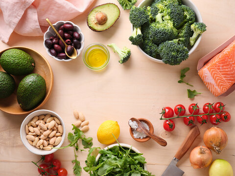 Healthy meal preparation with fresh ingredients on wooden table