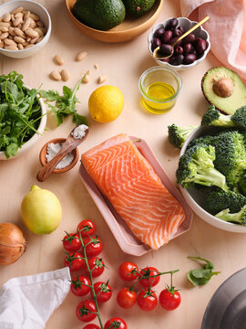Healthy meal preparation with fresh ingredients on a wooden table