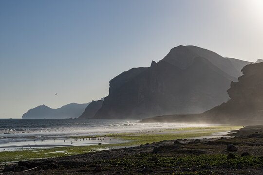 Backlight of Mughsail beach and the mountains, Salalah, Oman