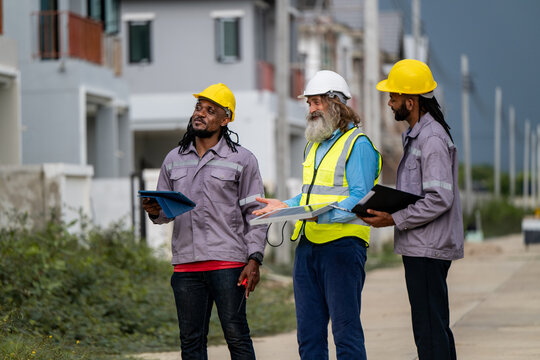 Engineers discussed preparation for installing small solar panels in residential village construction areas for sustainable energy projects and improving the landscape within the village project.