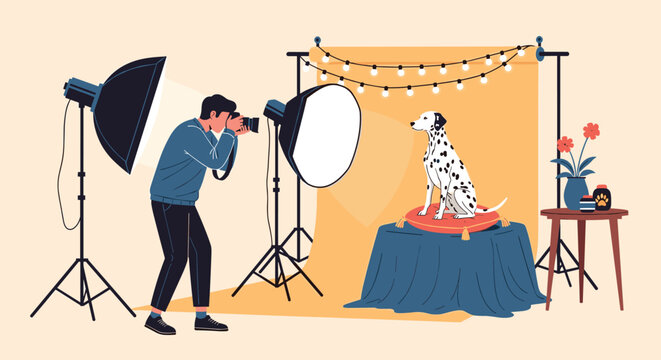 Professional photographer using camera and studio flash lights to take pictures of a cute dalmatian dog.