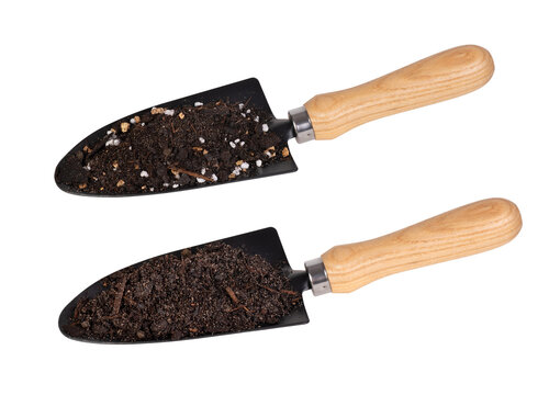 Gardening shovel  with two types of soil isolated on white background	