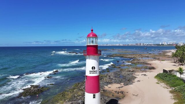 Itapua Lighthouse In Salvador Bahia Brazil. Aerial View Of A Bustling Ligthhouse In A Coast City. Beach Landscape. Summer Backgrounds. Salvador Bahia.