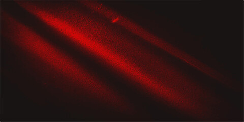 Abstract dark red streaks of light dance across a black background, creating a dramatic and moody visual. © mehek