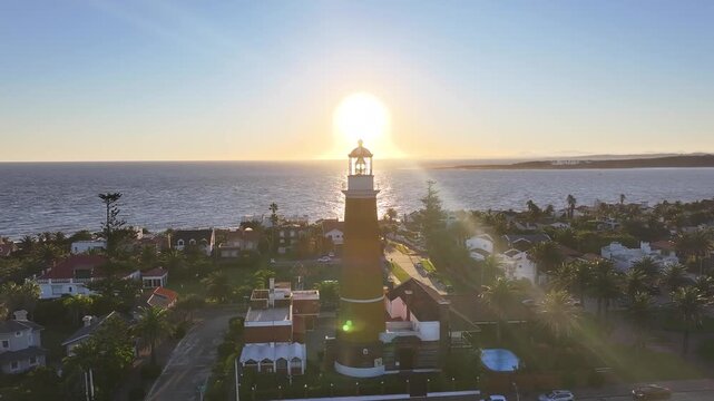 Sunset Punta Del Este Lighthouse In Punta Del Este Maldonado Uruguay. Birds Eye View Of Lighthouse Standing Tall Against The Blue Sky. Sunrise Landmark Coast. Beach Skyline. Punta Del Este Maldonado.