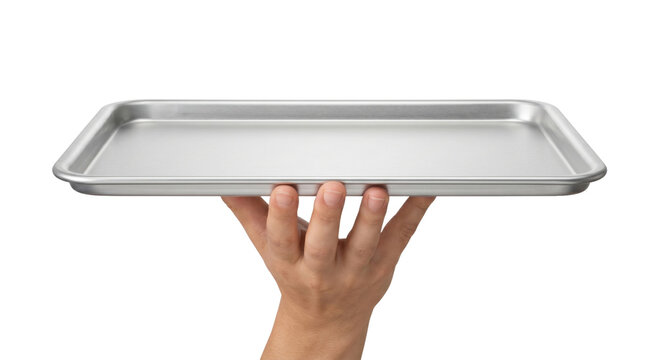 Hand holding a clean, empty aluminum baking sheet on a white background