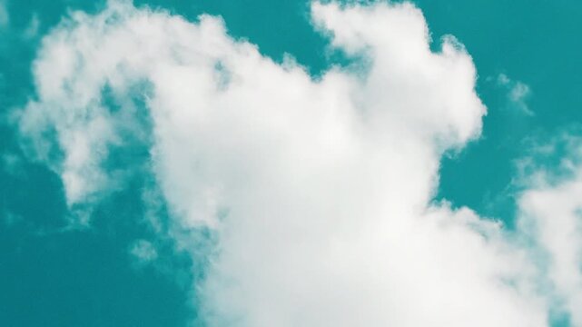 Cinematic teal color graded sky with white fluffy clouds timelapse, stylized film look summer sky footage as a scenic background for travel lifestyle and outdoor content 16:9