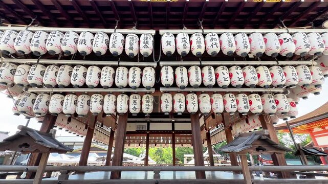 Rows of Traditional Japanese Paper Lanterns Hanging at a Shinto Shrine