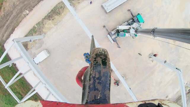 First person point of view from tower crane operating at a construction site