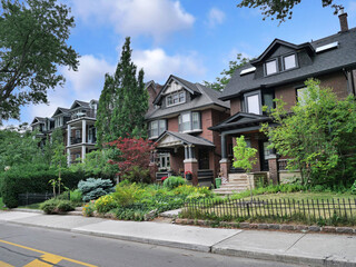 Obraz premium street of older brick houses with dormer windows