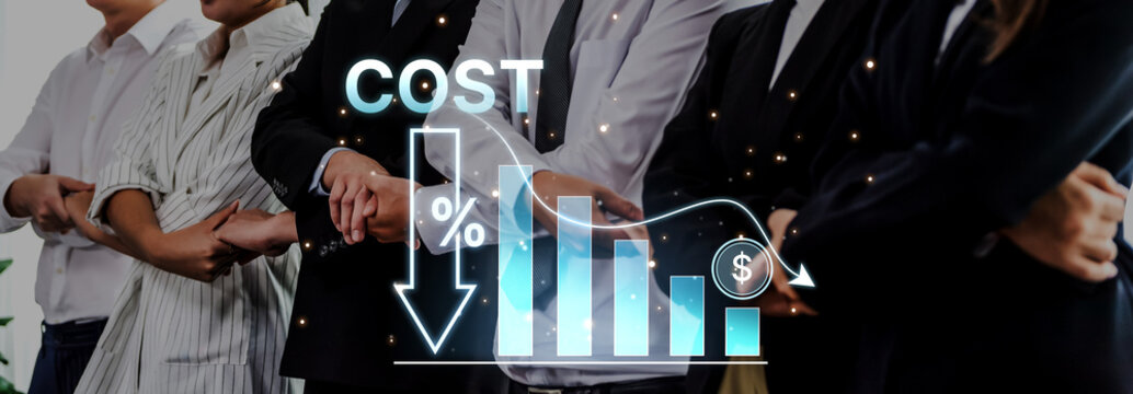 Business professionals collaborate to analyze cost reduction strategies with visual data representation, emphasizing financial trends and positive outcomes in a modern office environment. Trope